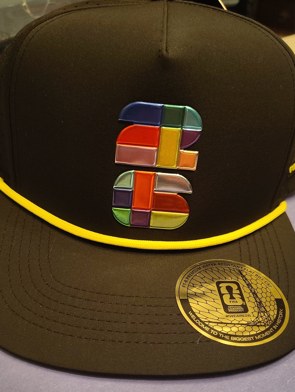 Black Snapback Hat with Multicolor Patch and Yellow Trim